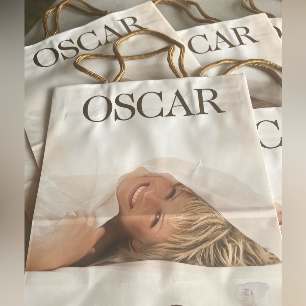 Oscar de la Renta gift bags with gold tone handles. New never used. Total 10.